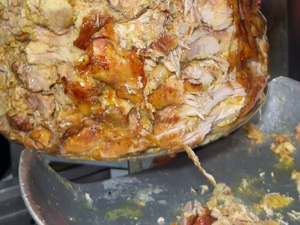 Chicken shawarma roasting on the vertical spit